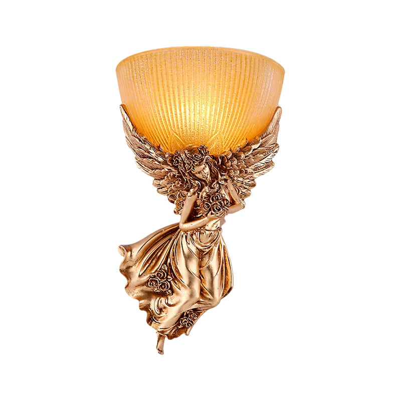 Single angel wall lamp with bulb, rustic golden resin wall lamp with amber-colored ribbed glass shade, right