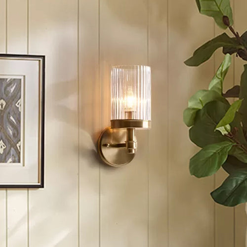 1-Light Wall-Mounted Lamp Traditional Cylinder Transparent Glass Wall Light in Brown/Gold above Bed