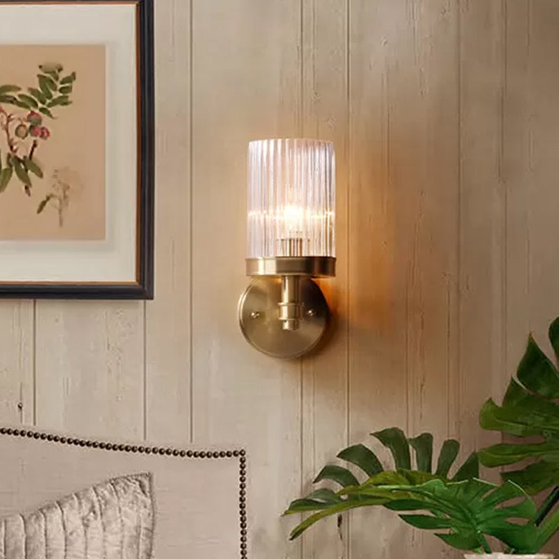 1-Light Wall-Mounted Lamp Traditional Cylinder Transparent Glass Wall Light in Brown/Gold above Bed