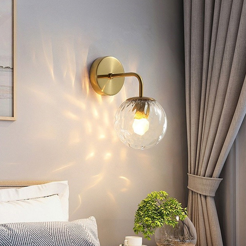 Ball-shaped wall lamp minimalist clear wave glass 1-light bedroom wall-mounted lighting with curved arm in black/gold