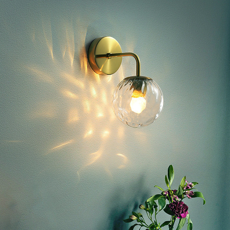 Ball-shaped wall lamp minimalist clear wave glass 1-light bedroom wall-mounted lighting with curved arm in black/gold