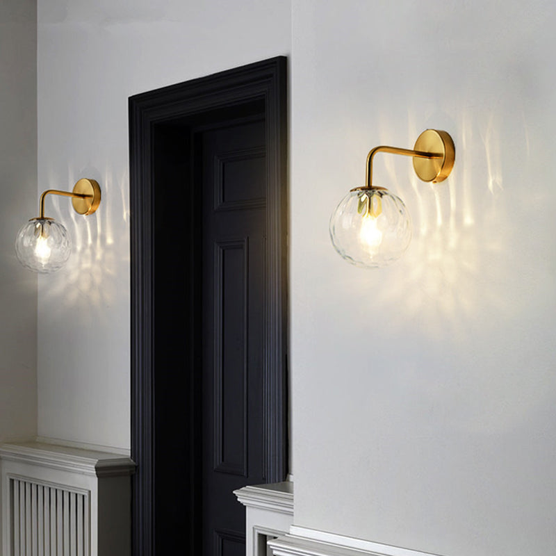 Ball-shaped wall lamp minimalist clear wave glass 1-light bedroom wall-mounted lighting with curved arm in black/gold
