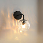 Ball-shaped wall lamp minimalist clear wave glass 1-light bedroom wall-mounted lighting with curved arm in black/gold