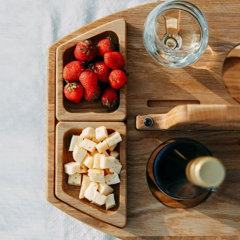 Compact picnic table with wooden bottle holder