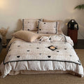 Quilted bedding set with heart and bow appliqué