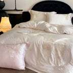 Luxurious satin bedding set with embroidered butterfly motifs and silky glossy finish