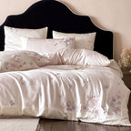 Luxurious satin bedding set with floral embroidery and butterfly appliqué