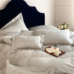Satin bedding set with delicate flower embroidery and silk-soft touch