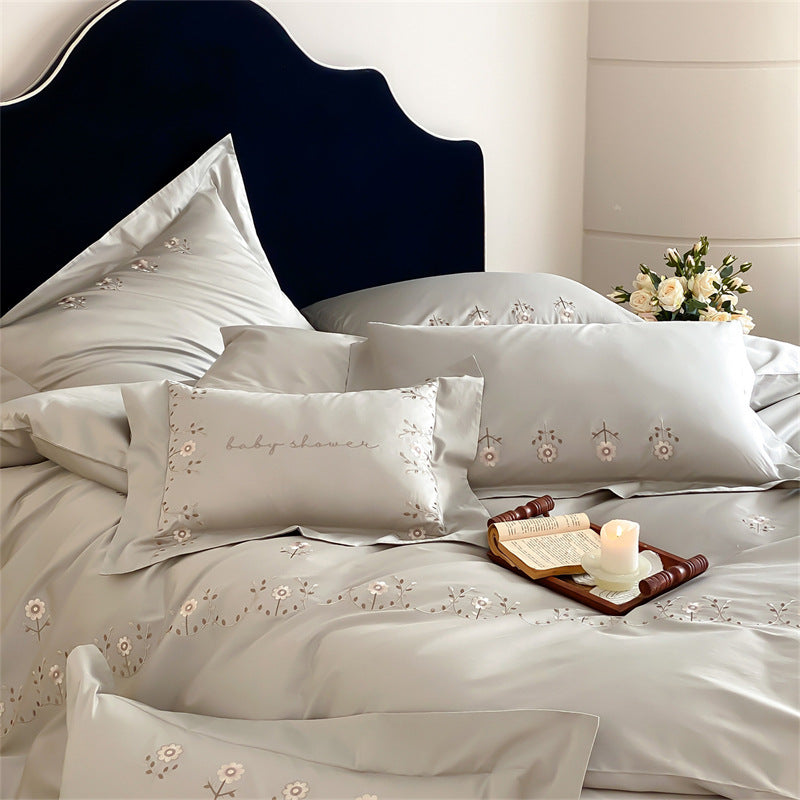Satin bedding set with delicate flower embroidery and silk-soft touch