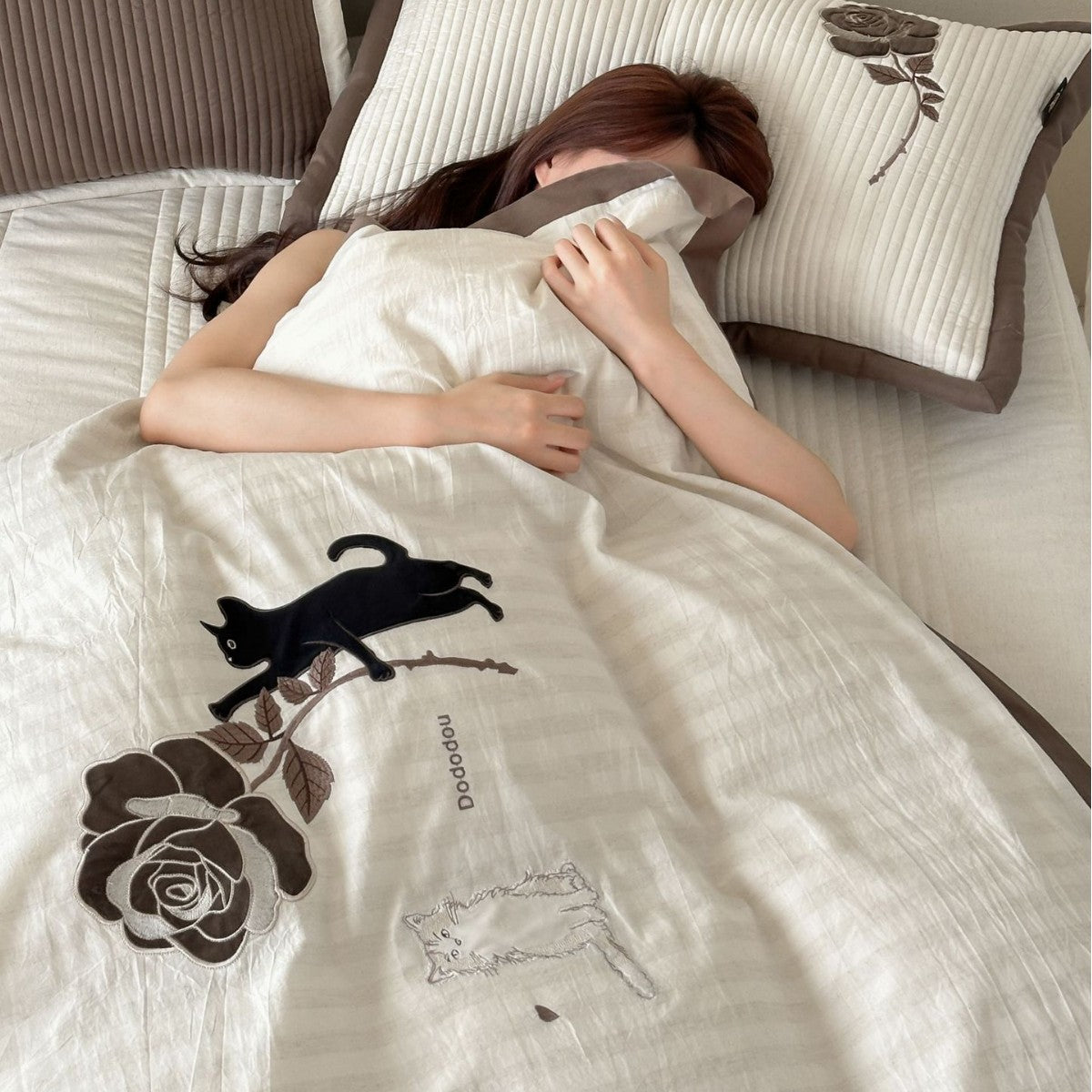striped cotton bedding set with embroidered teddy bear appliqués and button closure