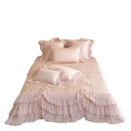 Romantic satin bedding and bedspread set with decorative ruffles and bows