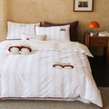 Bedding set made of cotton satin with embroidered cherry motifs