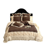 Opulent quilted bedding set with leopard pattern, ruffle trim and decorative embroidery