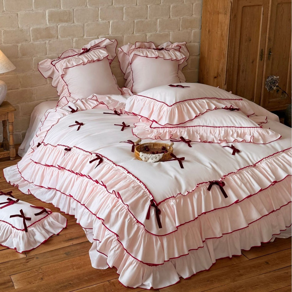 Romantic bedding set with ruffles, frills, and decorative bows