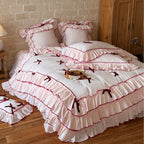 Romantic bedding set with ruffles, frills, and decorative bows