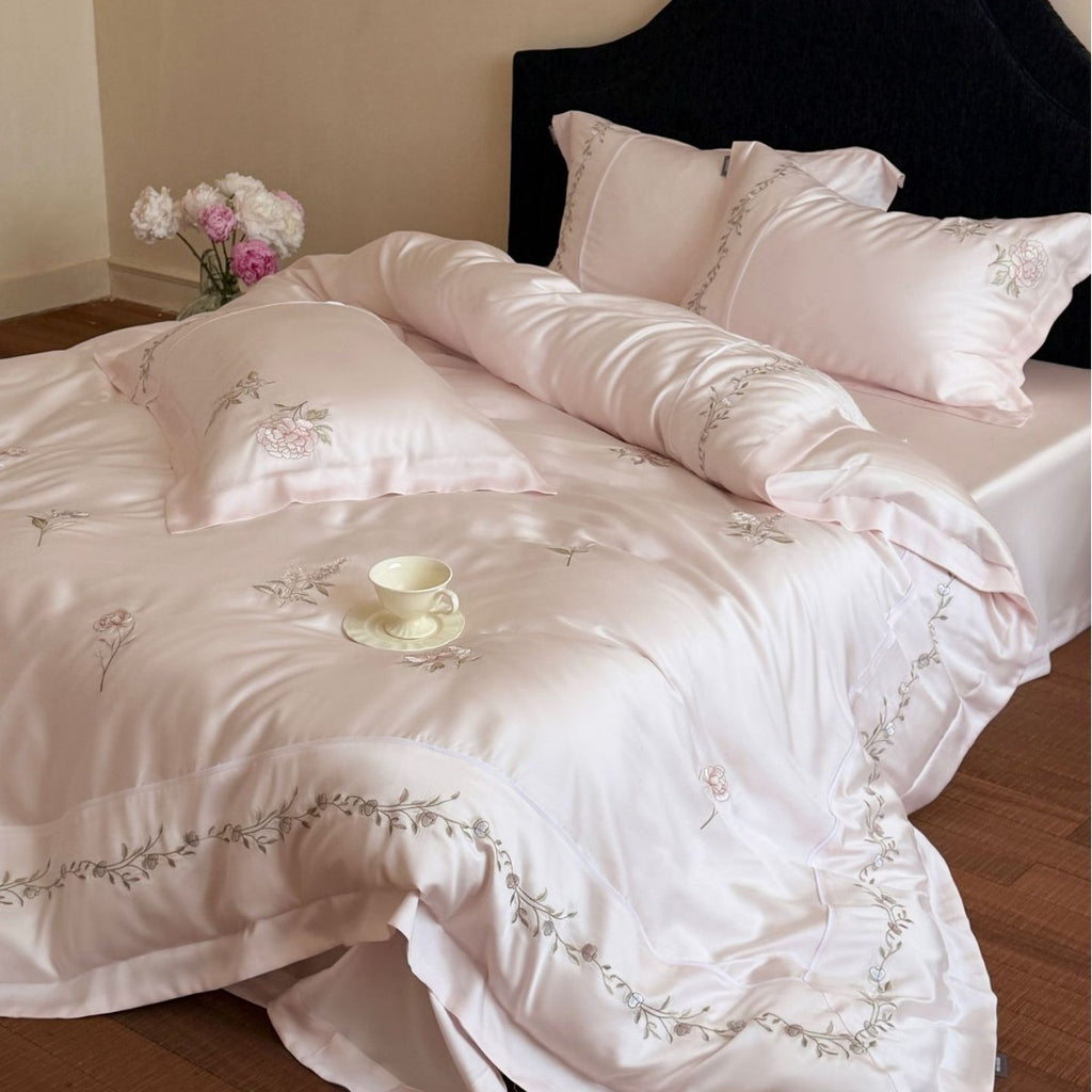 Elegant satin bedding set with fine floral embroidery and silky shiny drape