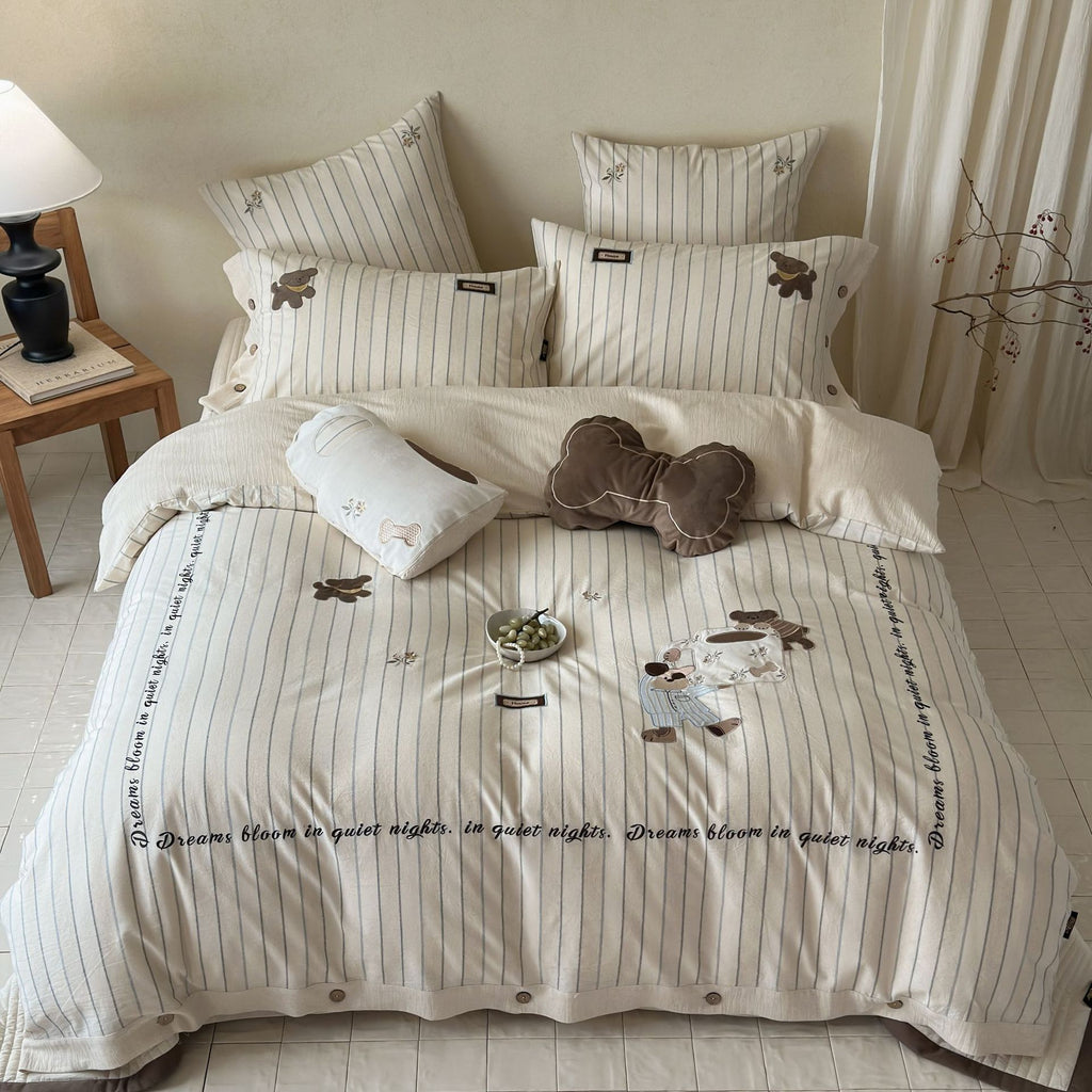 striped cotton bedding set with embroidered teddy bear appliqués and button closure