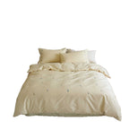 Embroidered cotton satin bedding set with subtle floral scatter design
