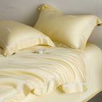 Silky-smooth cotton satin bedding set with fine decorative ribbon and pillowcases