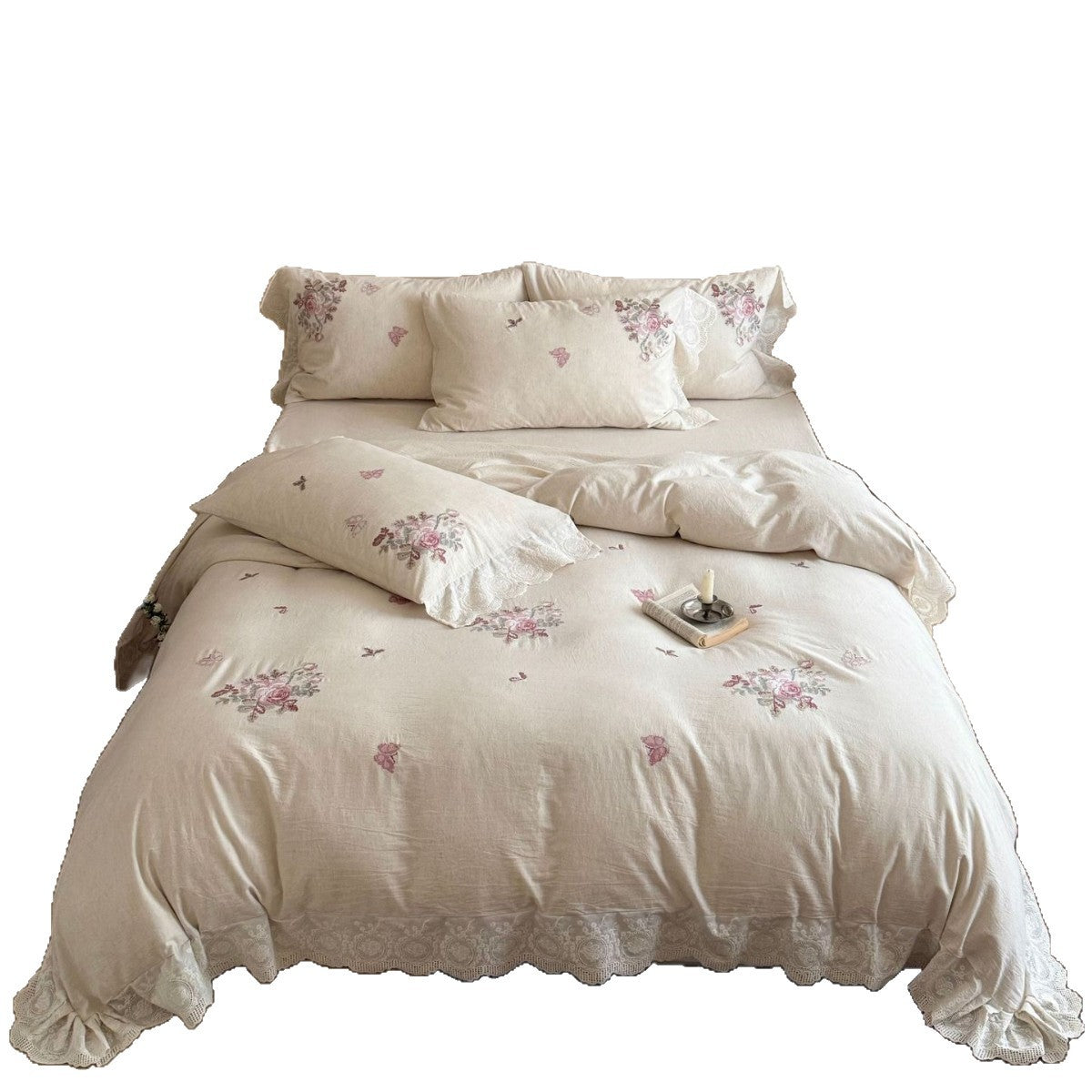 Embroidered cotton-linen bedding set with rose motifs, lace ruffle, and natural texture
