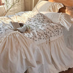 Bedding set with floral embroidered cover, gathered ruffle and cotton texture