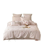 Embroidered cotton satin bedding set with decorative ribbons and floral appliqués