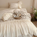 Bedding set with floral embroidered cover, gathered ruffle and cotton texture