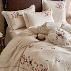 Romantic bedding set made of cotton-linen with floral embroidery and wavy hem