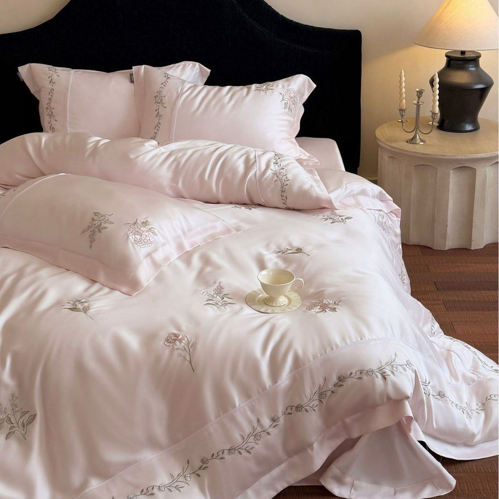 Elegant satin bedding set with fine floral embroidery and silky shiny drape