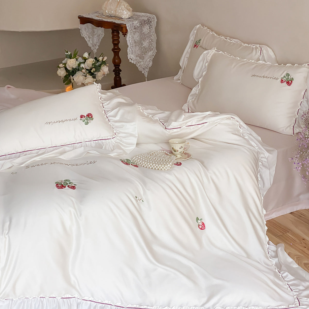 Romantic satin bedding set with strawberry embroidery and ruffles
