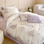 Finely embroidered bedding set with floral motifs and animal appliqués
