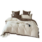 striped cotton bedding set with embroidered teddy bear appliqués and button closure
