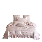 Luxurious cotton satin bedding set with floral embroidery, ruffle and decorative pillow