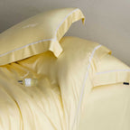 Silky-smooth cotton satin bedding set with fine decorative ribbon and pillowcases