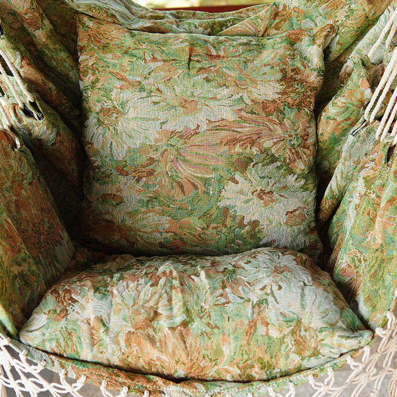 Woven Hammock Chair with Padded Floral Cushions and Macramé Fringe