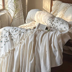 Bedding set with floral embroidered cover, gathered ruffle and cotton texture