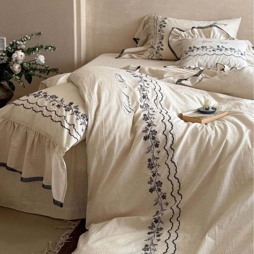 Bedding set with embroidered ruffles and linen look
