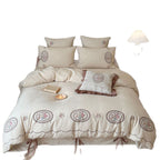 Romantic cotton-linen bedding set with embroidered flower medallions and ruffles