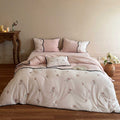 Embroidered bedding set with rose embroidery and contrasting piping