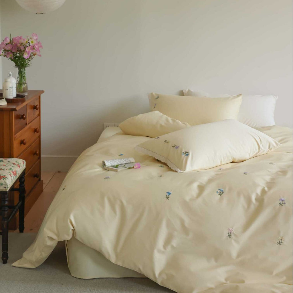 Embroidered cotton satin bedding set with subtle floral scatter design