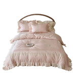 Duvet cover set with ruffle trim, fine lace border, and subtle jacquard structure