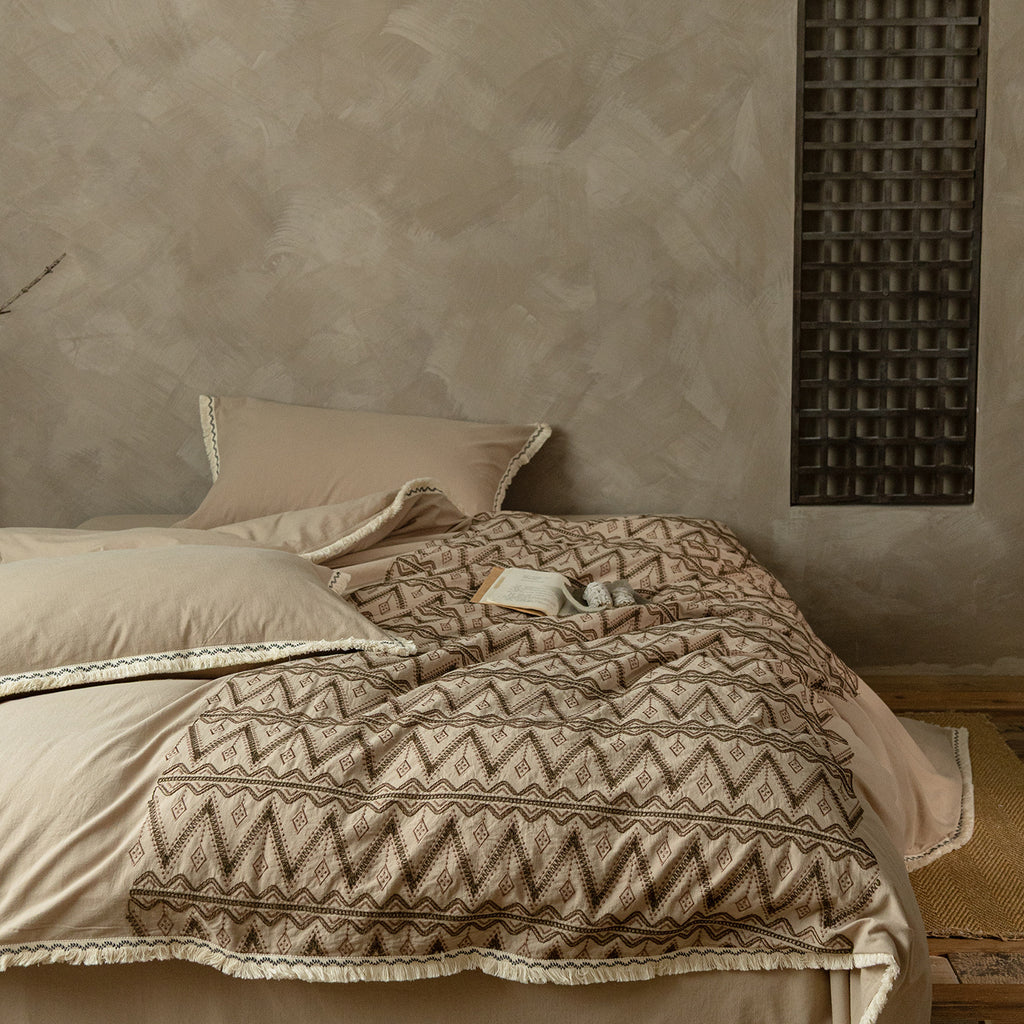Premium cotton bedding set with woven ethnic overlay and fringes