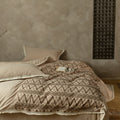Premium cotton bedding set with woven ethnic overlay and fringes