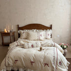 Romantic cotton-linen bedding set with ruffle, rose embroidery and bolster pillow