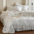 Bedding set in vintage look made of lightweight cotton muslin with lace ruffle and fine floral embroidery