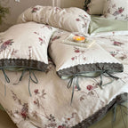 Percale bedding set with floral vintage embroidery, lace trim, and ties