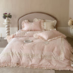 Duvet cover set with ruffle trim, fine lace border, and subtle jacquard structure