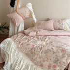 Bedding set with pleated frill, lace border, and floral print