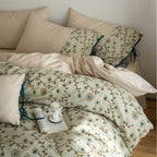 Embroidered cotton percale bedding set with quilted decorative plate and decorative ribbons
