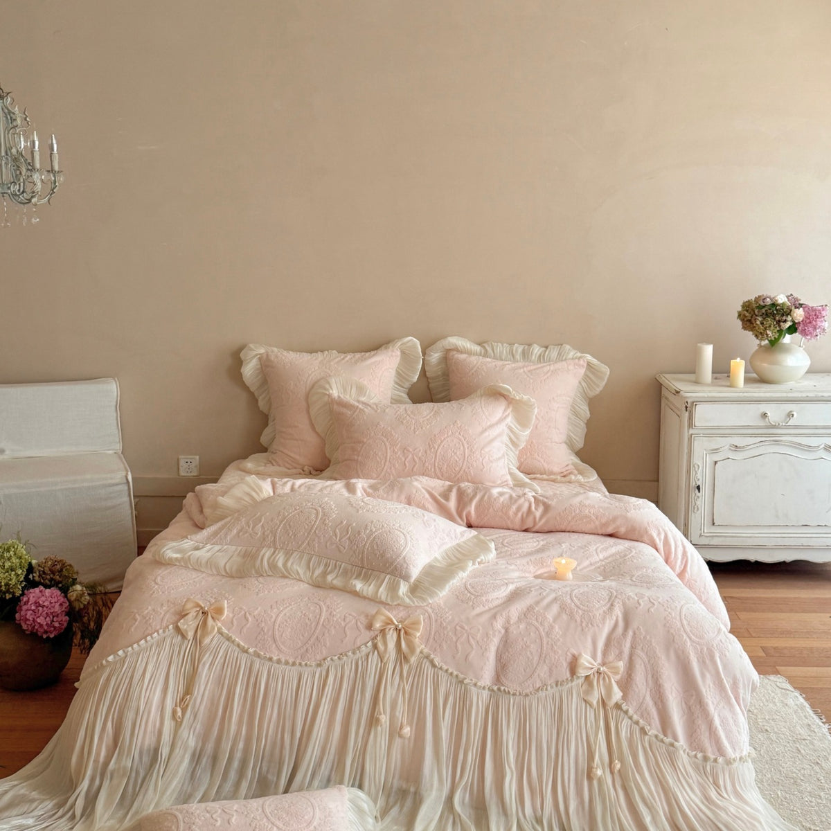 Romantic bedding set made of cotton satin with quilted duvet cover, decorative ruffled trim and bow appliqués